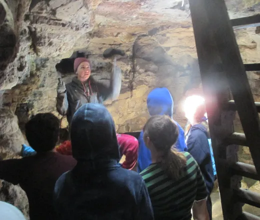 Campers exploring a cave system